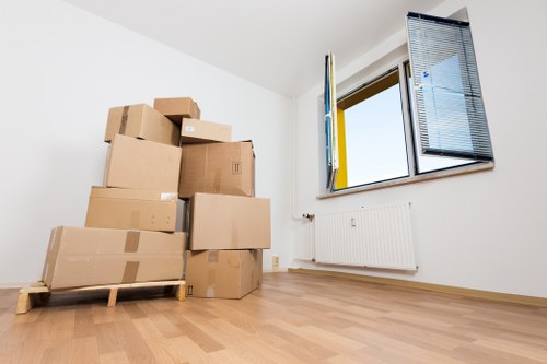 Packed boxes and furniture being loaded into a removal van for a Harringay move