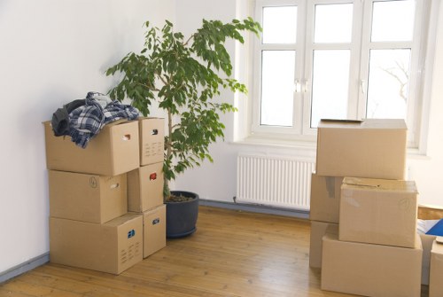 Local movers handling boxes and furniture in a Harringay flat