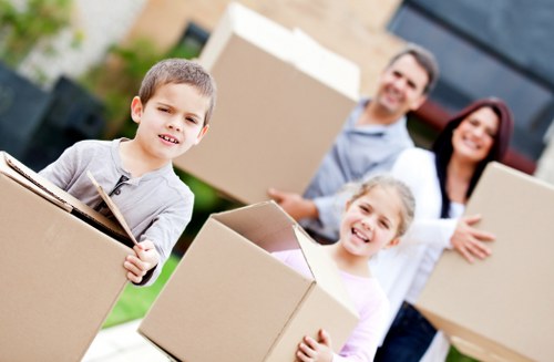Careful packing of fragile household items in Harringay