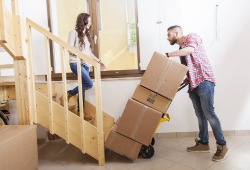 Professional removals team unloading belongings safely at the destination